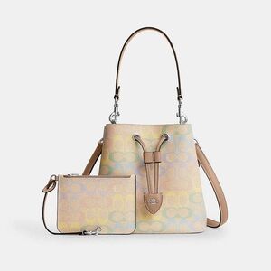 Coming soon NWT Coach Rowan Bucket Bag
In Rainbow Signature Canvas CDA92